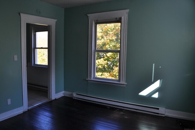 21 Violet St, Waterbury, CT 06704 - spare room with baseboard heating, baseboards, and a wealth of natural light