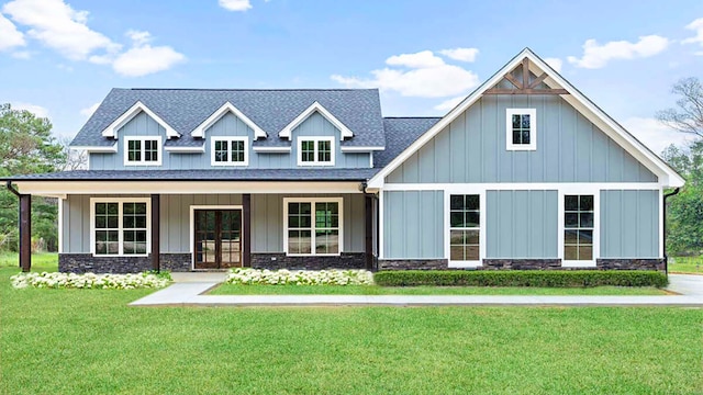 craftsman-style home featuring a porch and a front lawn