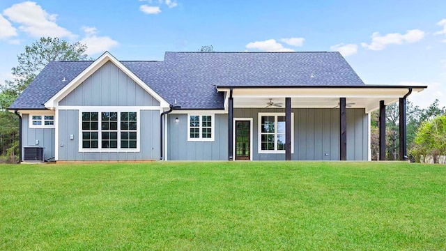 back of house featuring a yard and ceiling fan