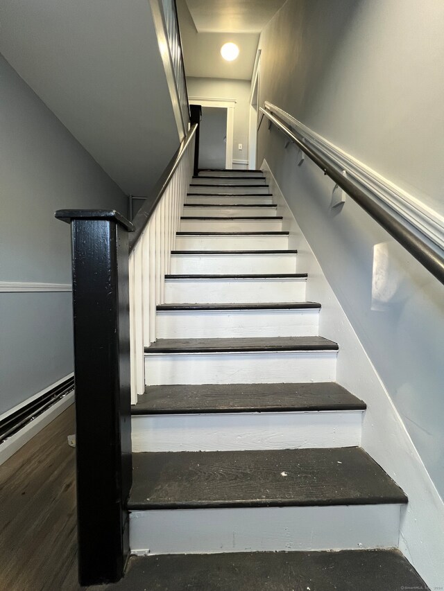 stairs with wood-type flooring