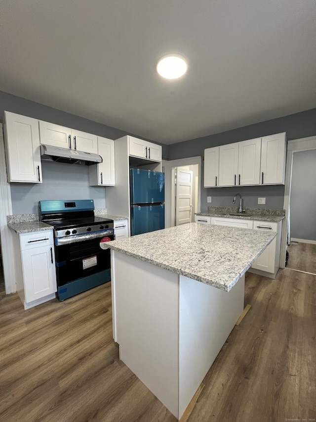 509 S Main St, Torrington, CT 06790 - kitchen with a sink, stainless steel electric stove, freestanding refrigerator, under cabinet range hood, and dark wood finished floors