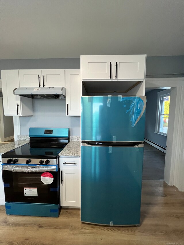 kitchen with black electric range oven, light hardwood / wood-style flooring, a baseboard radiator, white cabinets, and stainless steel refrigerator