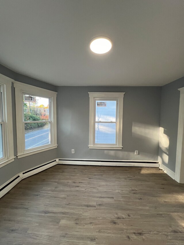 spare room with wood-type flooring