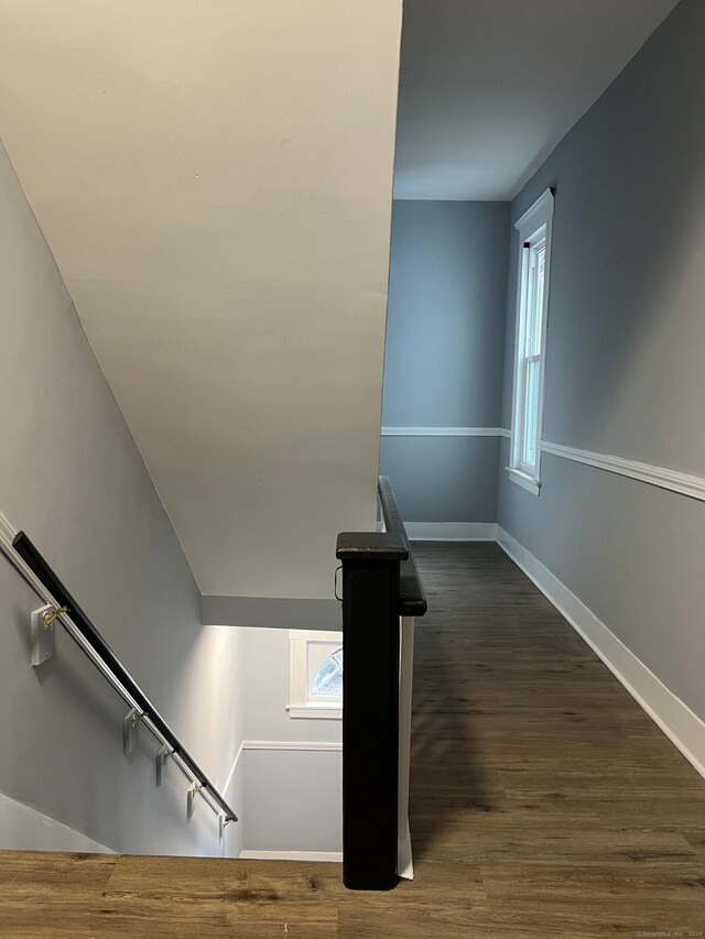 stairs featuring wood-type flooring