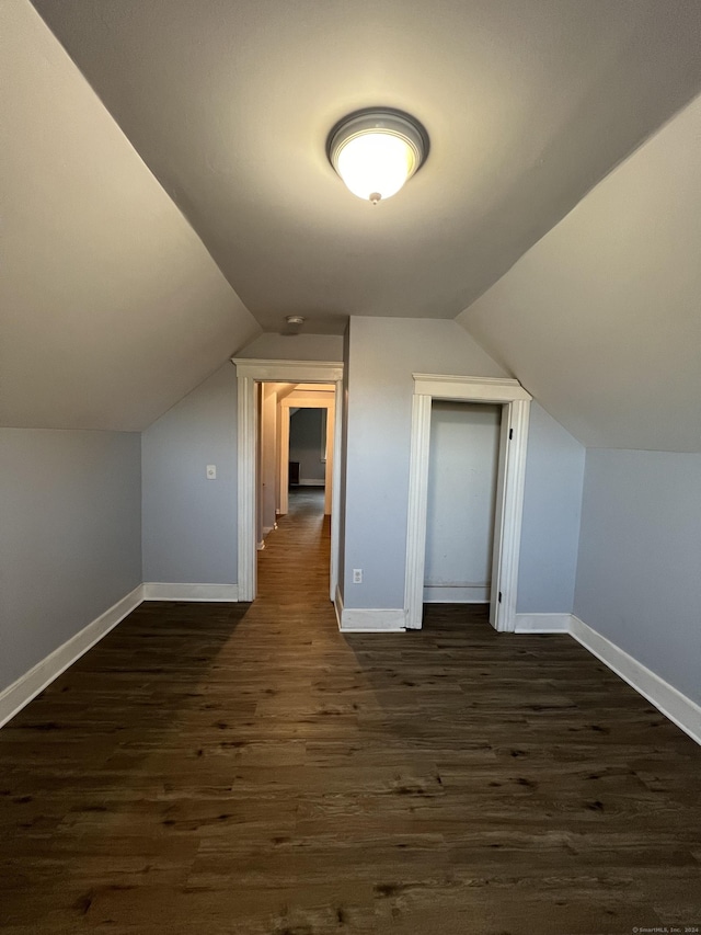 509 S Main St, Torrington, CT 06790 - additional living space with lofted ceiling, dark wood-style floors, and baseboards