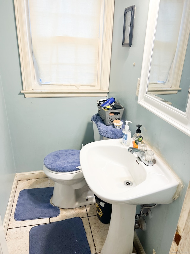 bathroom featuring tile patterned floors and toilet