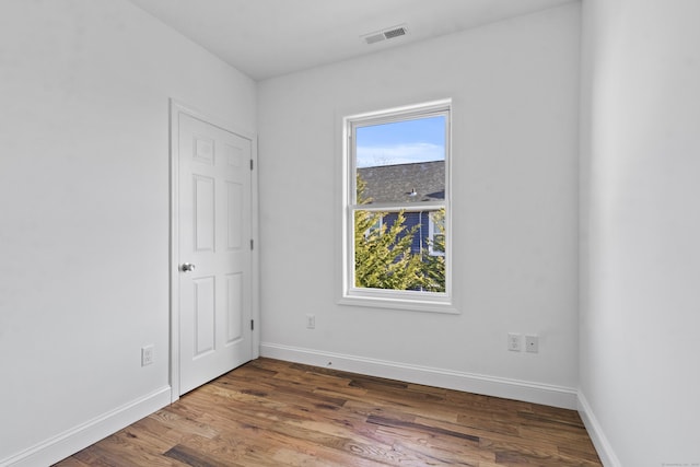 empty room featuring hardwood / wood-style flooring