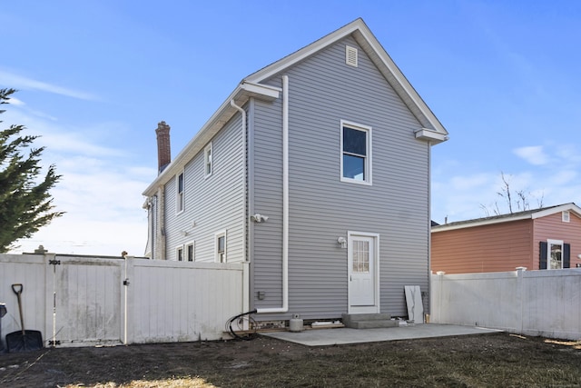 rear view of house with a patio