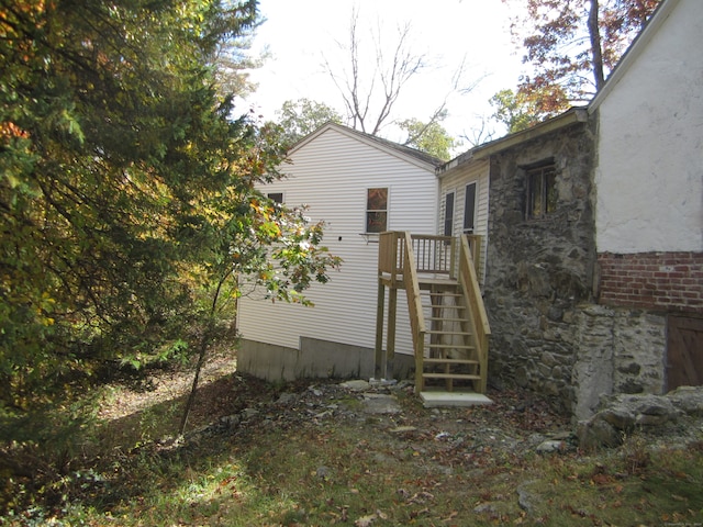 view of side of property featuring a deck