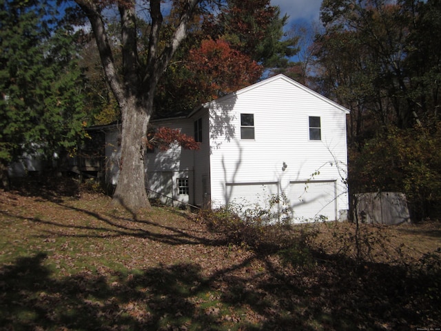 view of side of property with a garage