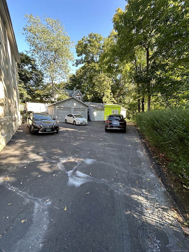 view of parking / parking lot with a garage