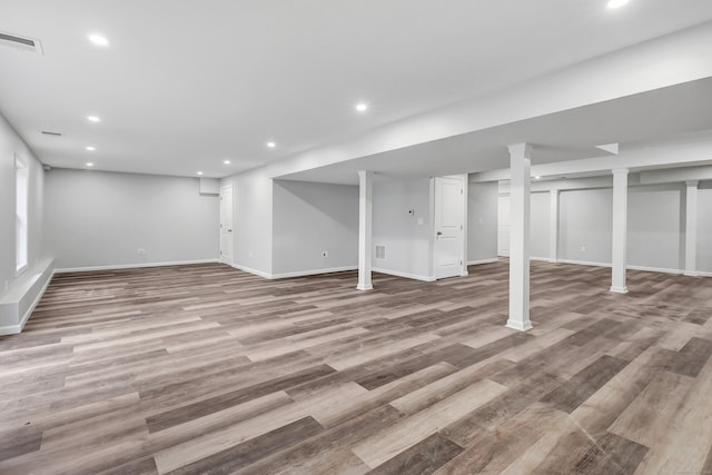 basement with wood-type flooring