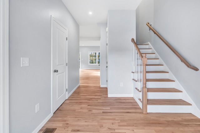 stairway featuring hardwood / wood-style flooring