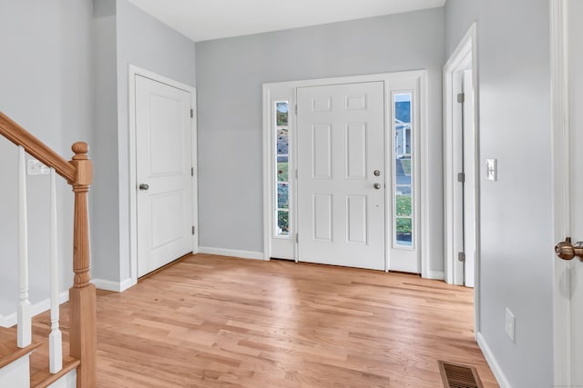 foyer featuring a healthy amount of sunlight and light hardwood / wood-style floors