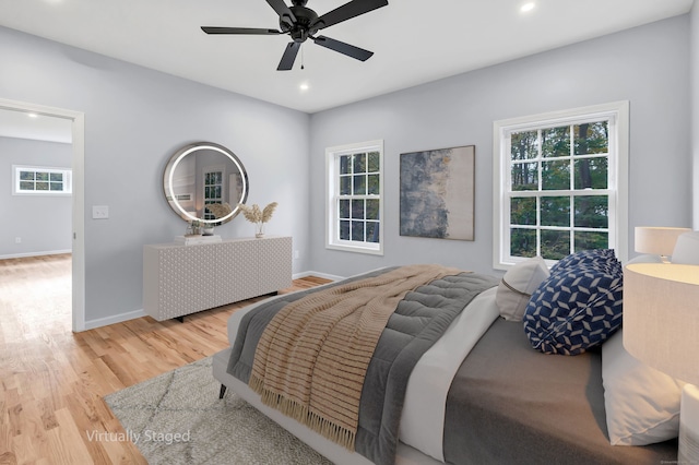 bedroom featuring light wood-type flooring and ceiling fan