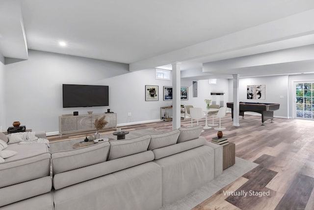 living room with light hardwood / wood-style flooring and pool table