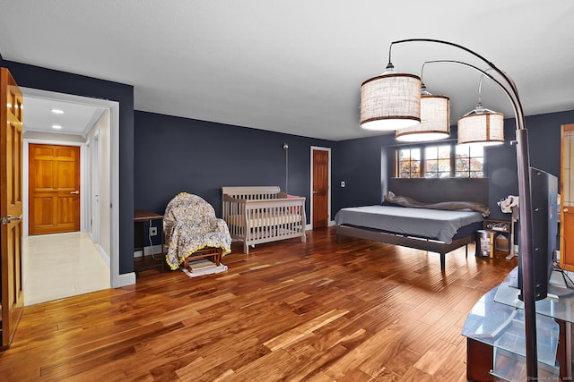 bedroom featuring wood-type flooring