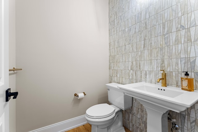 167 Willow Creek Estates Dr, Southbury, CT 06488 - bathroom with toilet, baseboards, wood finished floors, and tile walls