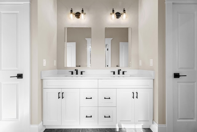 167 Willow Creek Estates Dr, Southbury, CT 06488 - bathroom featuring double vanity and baseboards