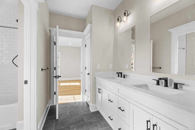 bathroom with vanity and tiled shower / bath