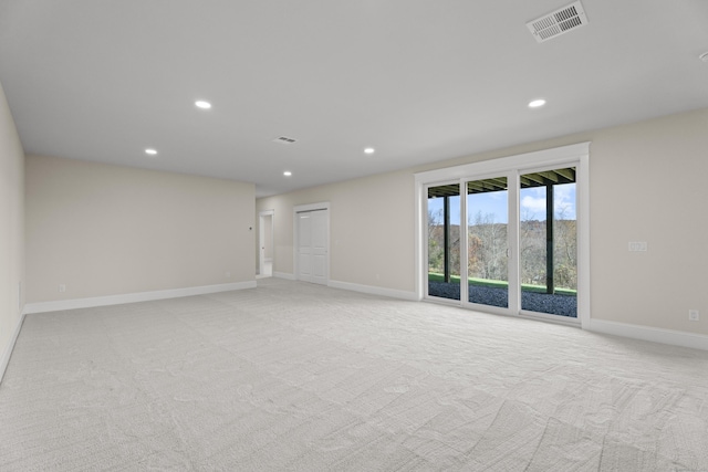 empty room with light colored carpet