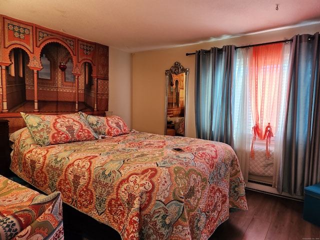 bedroom featuring dark hardwood / wood-style flooring