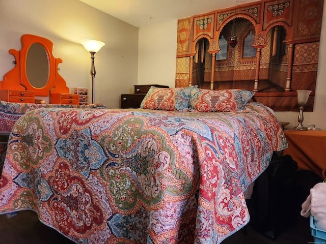 bedroom with wood-type flooring