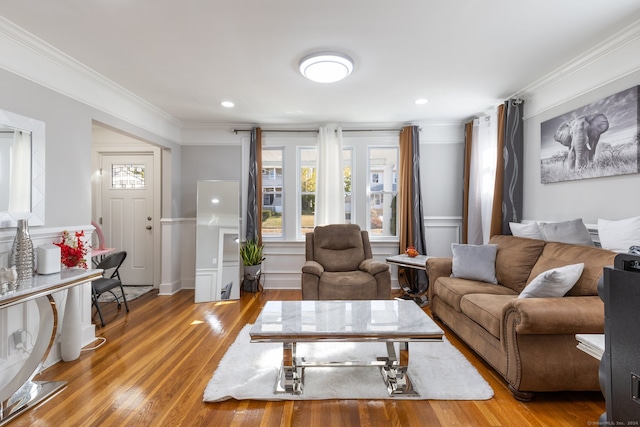 living room featuring crown molding and wood-type flooring