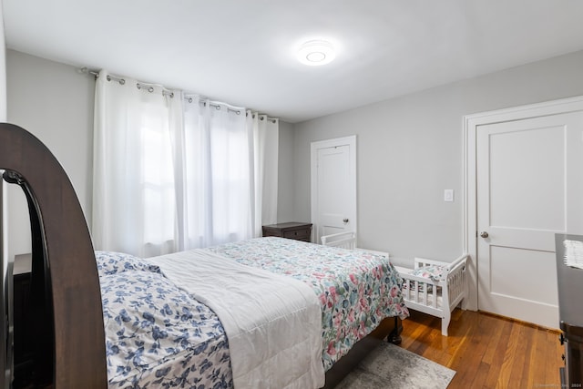 bedroom featuring dark hardwood / wood-style flooring