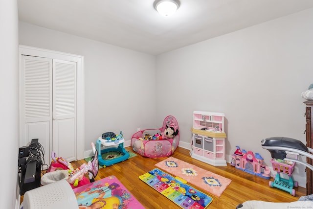 game room featuring hardwood / wood-style floors