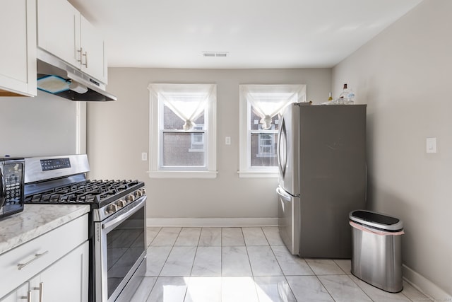 kitchen with white cabinetry and appliances with stainless steel finishes