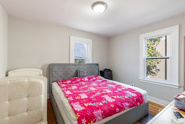 bedroom featuring dark hardwood / wood-style floors