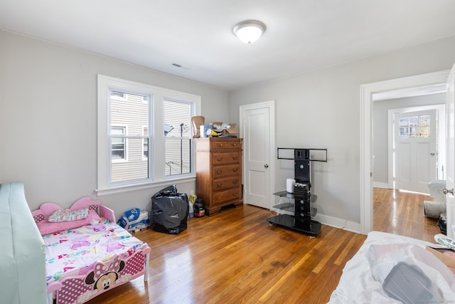 bedroom with hardwood / wood-style floors