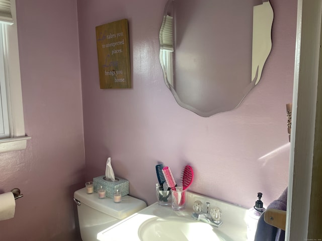 bathroom with toilet and sink