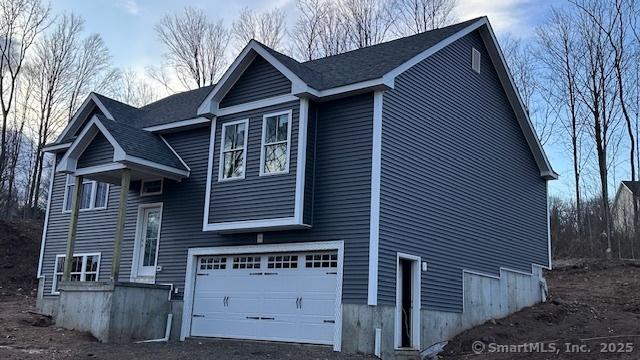 bi-level home featuring a garage