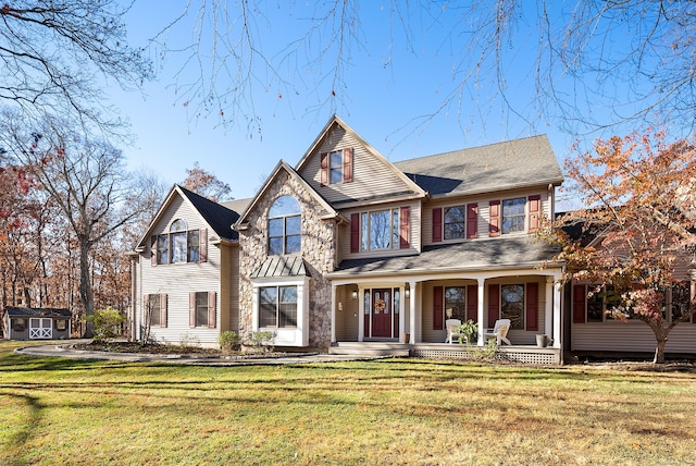 18 Eastern Ln, New Milford, CT 06776 - view of front facade featuring a storage shed, covered porch, and a front lawn