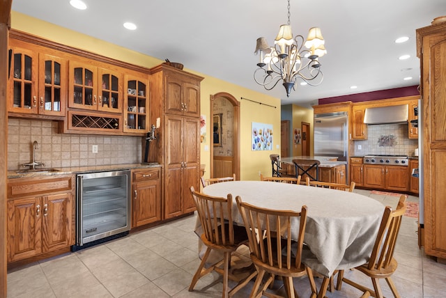 18 Eastern Ln, New Milford, CT 06776 - dining space with beverage cooler, light tile patterned flooring, wet bar, recessed lighting, and arched walkways