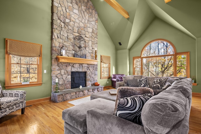 18 Eastern Ln, New Milford, CT 06776 - living room with high vaulted ceiling, plenty of natural light, wood finished floors, and a fireplace