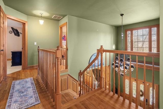 18 Eastern Ln, New Milford, CT 06776 - hall featuring an upstairs landing, wood finished floors, and a chandelier