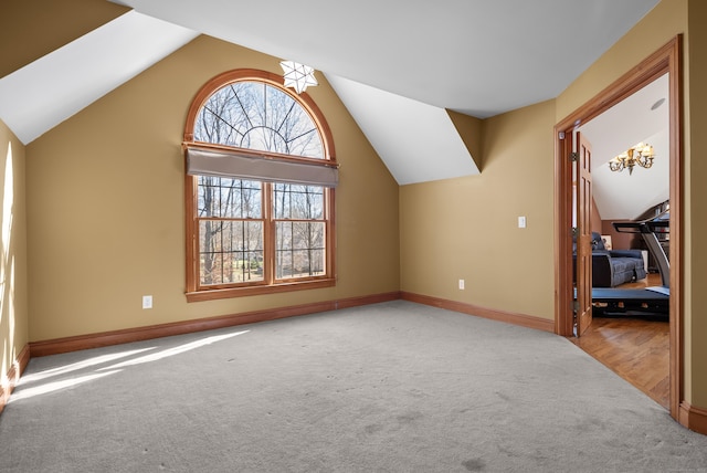 18 Eastern Ln, New Milford, CT 06776 - additional living space with carpet floors, a chandelier, and lofted ceiling