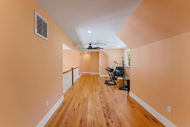 workout area featuring recessed lighting, light wood-type flooring, visible vents, and baseboards