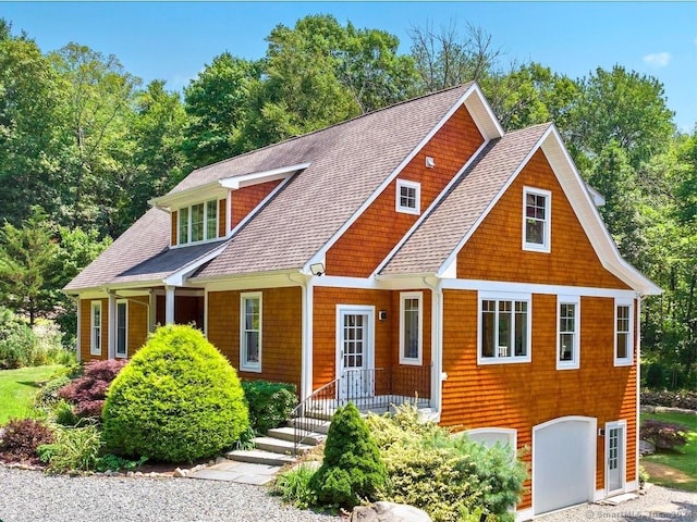 view of front of house with a shingled roof