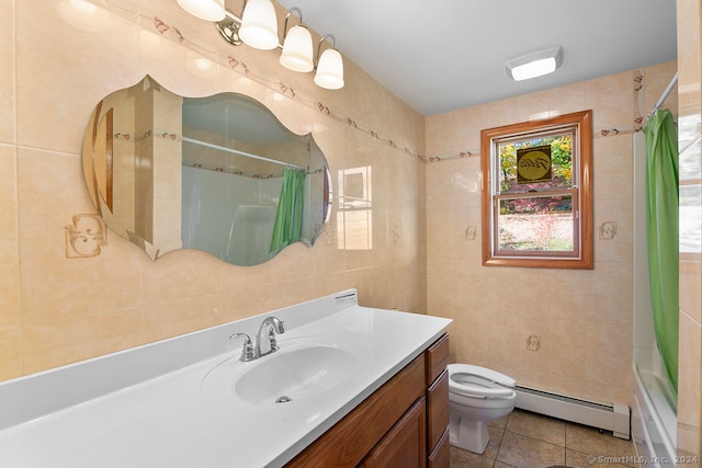 full bathroom featuring baseboard heating, tile walls, vanity, and toilet