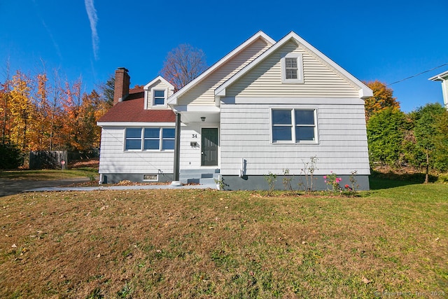 view of front of property with a front lawn