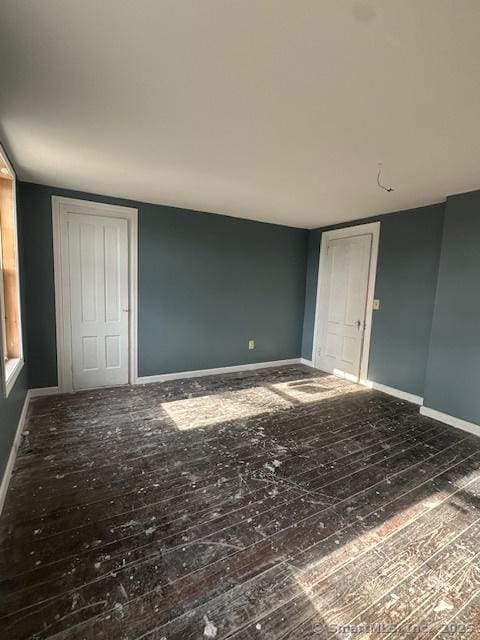 interior space with dark hardwood / wood-style floors