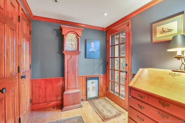 interior space with light hardwood / wood-style floors and ornamental molding