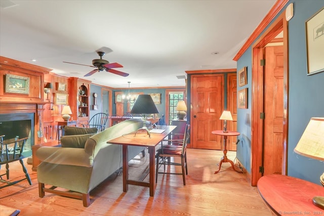 dining space featuring ceiling fan and light wood-type flooring