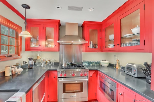 kitchen featuring wall chimney exhaust hood, stainless steel appliances, and pendant lighting