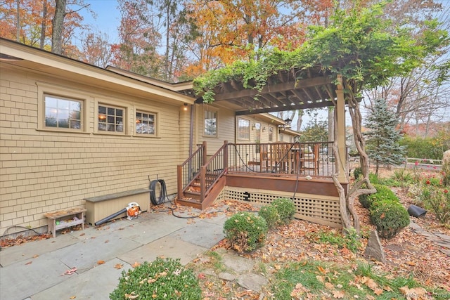 back of house featuring a patio area and a wooden deck