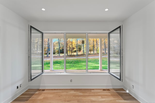 spare room with light hardwood / wood-style flooring